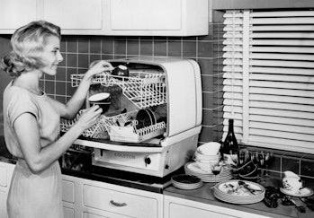 Demonstrating the Colston dishwasher, 18 November 1959. This dishwasher, made by Charles Colston Ltd...